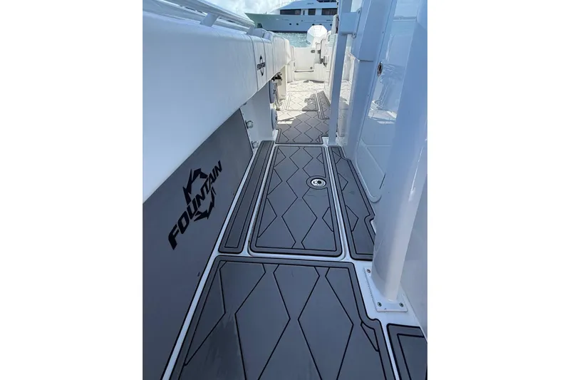  Yacht Photos Pics 2023 Fountain 34 Center Console boat deck with sleek design and logo.