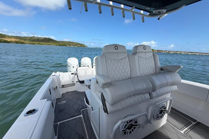  Yacht Photos Pics 2023 Fountain 34 Center Console boat with luxurious seating on open water.