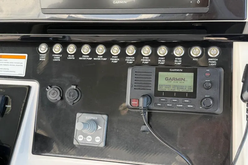  Yacht Photos Pics Control panel of 2023 Fountain 34 Center Console with Garmin marine radio.