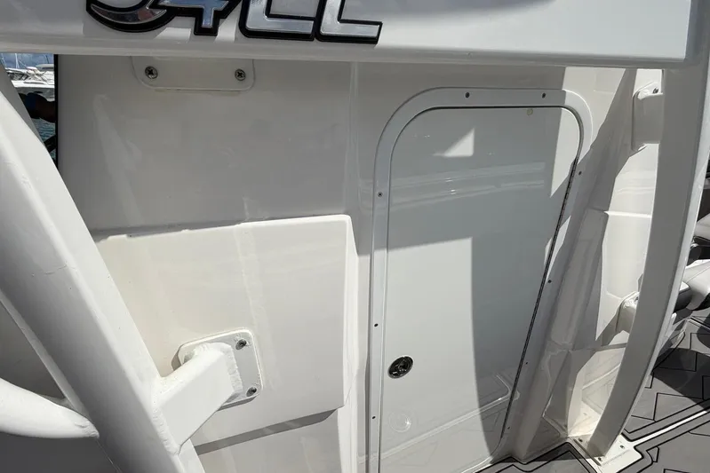  Yacht Photos Pics 2023 Fountain 34 Center Console boat interior detail with door and structural elements.