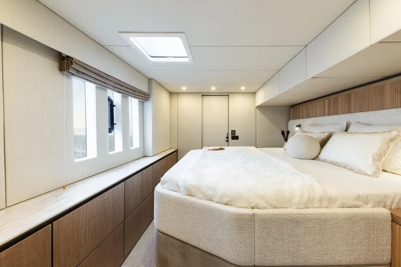 Spice Of Life II Yacht Photos Pics Luxurious Sunreef 60 yacht bedroom interior, 2025 model, featuring elegant design and natural light.