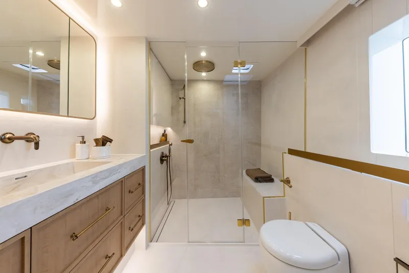 Spice Of Life II Yacht Photos Pics Luxurious bathroom in 2025 Sunreef 60 yacht with modern fixtures and elegant design.