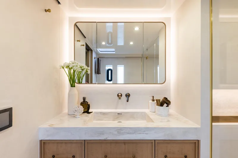 Spice Of Life II Yacht Photos Pics Luxurious bathroom on 2025 Sunreef 60 yacht with modern sink and elegant decor.