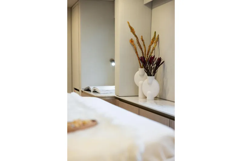 Spice Of Life II Yacht Photos Pics Luxurious Sunreef 60 yacht interior, featuring elegant decor with vases and floral arrangement, 2025 model.