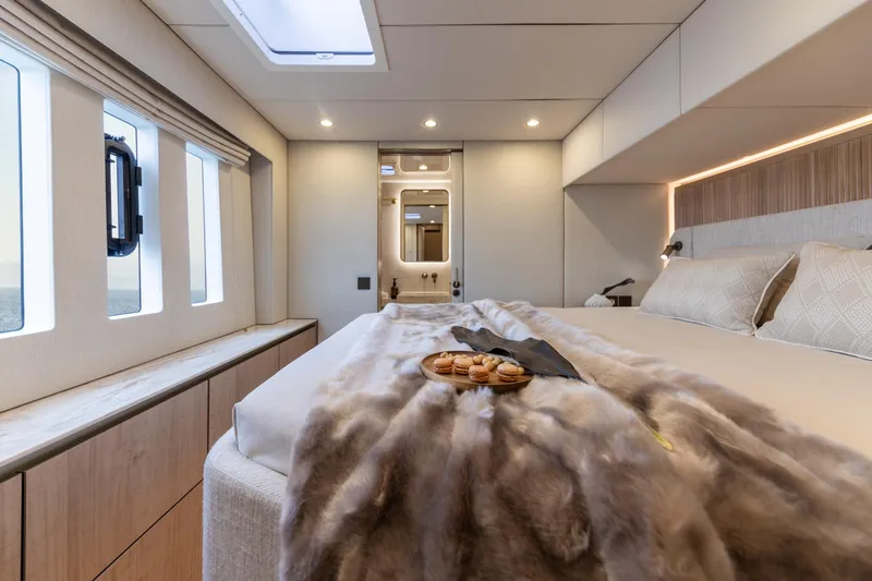 Spice Of Life II Yacht Photos Pics Luxurious Sunreef 60 yacht bedroom interior, 2025 model, featuring elegant decor and natural light.