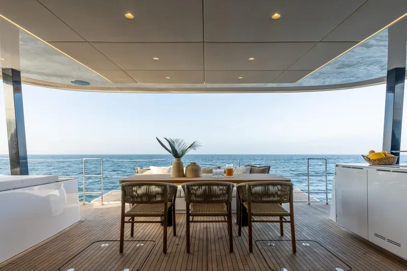 Spice Of Life II Yacht Photos Pics Luxurious Sunreef 60 yacht deck with dining area overlooking the ocean, 2025 model.