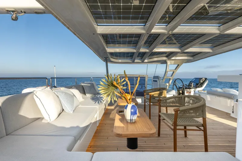 Spice Of Life II Yacht Photos Pics Luxurious Sunreef 60 yacht deck with elegant seating, solar panels, and ocean view, 2025 model.