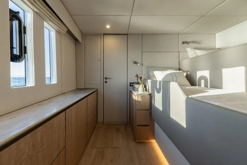 Spice Of Life II Yacht Photos Pics Luxurious interior of 2025 Sunreef 60 yacht cabin with modern design and natural light.