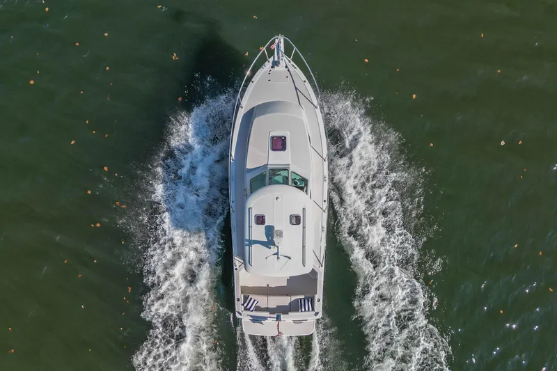  Yacht Photos Pics Aerial view of 2008 Back Cove 29 boat cruising on water.