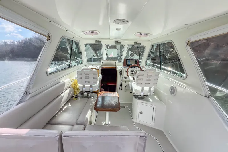  Yacht Photos Pics Interior of a 2008 Back Cove 29 boat with seating and helm station.