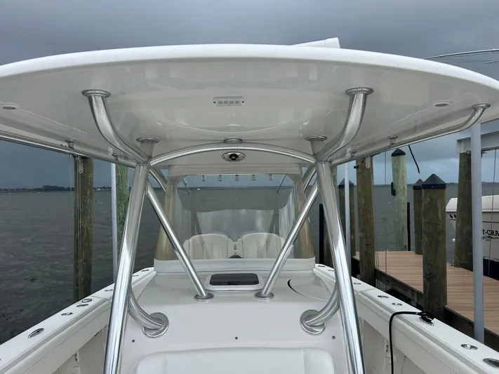  Yacht Photos Pics 2013 Jupiter 34 boat with T-top and stainless steel supports at dock.