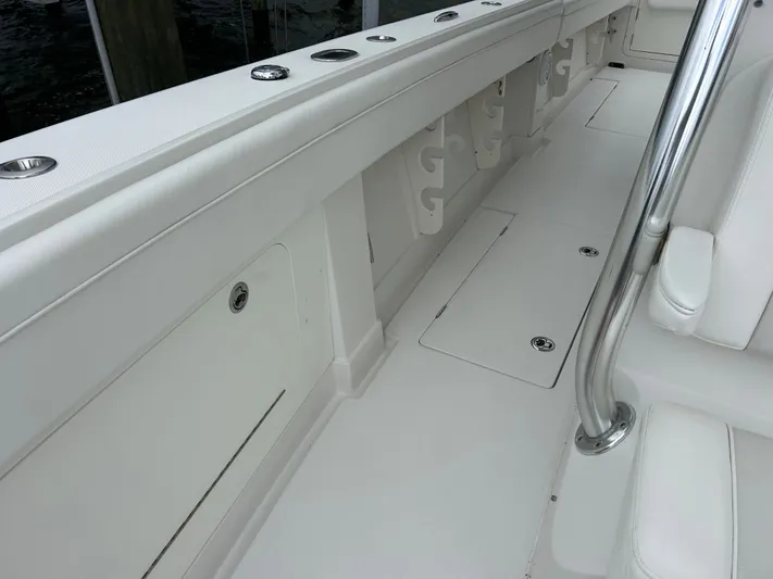  Yacht Photos Pics 2013 Jupiter 34 boat interior with white seating and storage compartments.