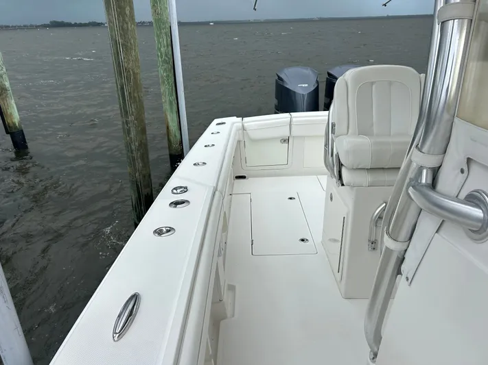  Yacht Photos Pics 2013 Jupiter 34 boat interior with white seating and dual outboard motors.