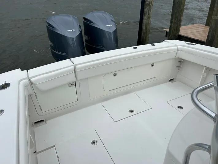  Yacht Photos Pics 2013 Jupiter 34 boat deck with twin Yamaha outboard motors at dock.