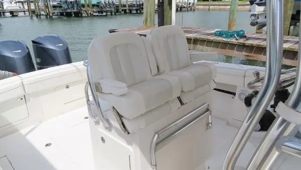  Yacht Photos Pics 2013 Jupiter 34 boat with dual white cushioned seats and twin outboard motors.