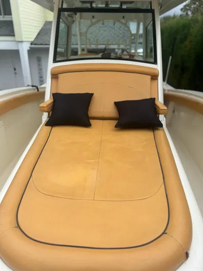  Yacht Photos Pics Luxurious 2014 Scout 350 LXF boat with tan seating and black cushions.