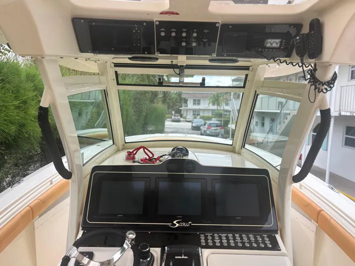  Yacht Photos Pics 2014 Scout 350 LXF boat dashboard with navigation screens and controls.