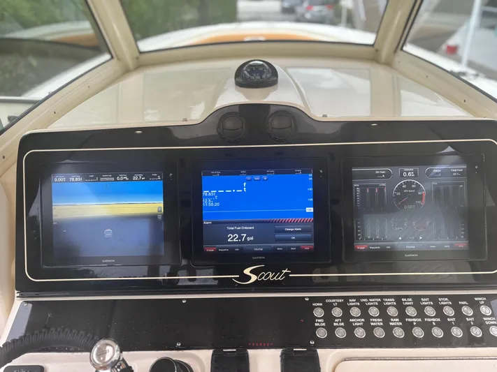  Yacht Photos Pics Dashboard of a 2014 Scout 350 LXF boat with navigation screens.