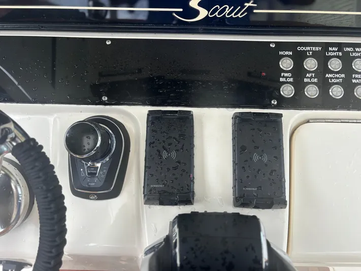  Yacht Photos Pics Control panel of a 2014 Scout 350 LXF boat with various switches and controls.