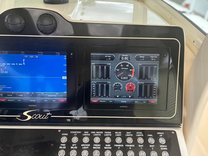  Yacht Photos Pics Control panel of a 2014 Scout 350 LXF boat with digital displays and buttons.