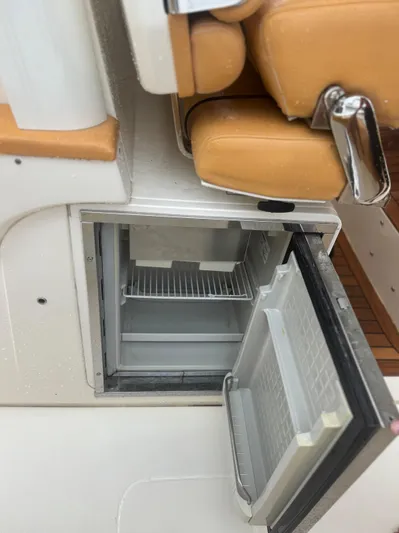 Yacht Photos Pics Open mini fridge on 2014 Scout 350 LXF boat with tan seating.