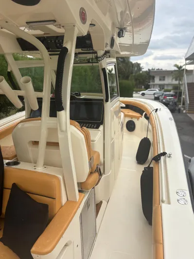  Yacht Photos Pics 2014 Scout 350 LXF boat with tan seating and modern dashboard.