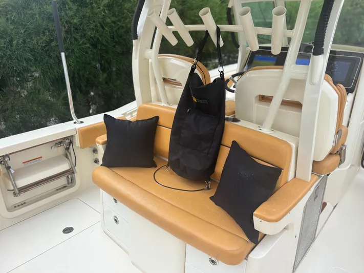  Yacht Photos Pics 2014 Scout 350 LXF boat interior with tan seating and black accessories.