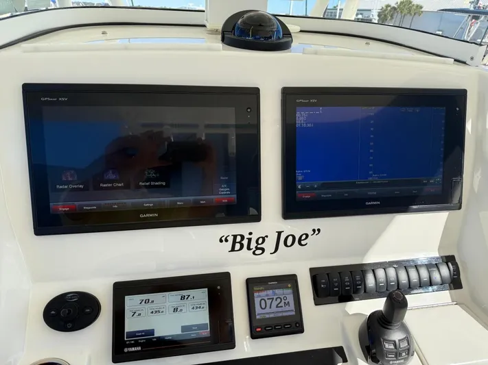 Deadicated Yacht Photos Pics Control panel of 2019 Regulator 31 boat with navigation screens and controls, labeled "Big Joe."