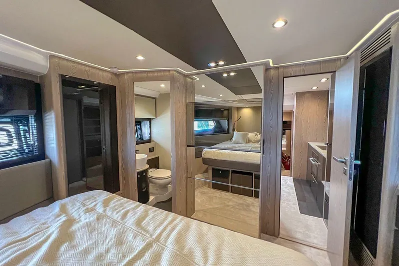  Yacht Photos Pics Luxurious interior of 2024 Azimut Atlantis 51 yacht with modern bedroom and bathroom.