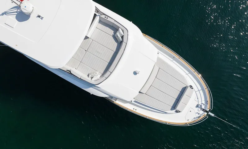  Yacht Photos Pics Aerial view of 2025 Sirena 48 yacht on calm water.