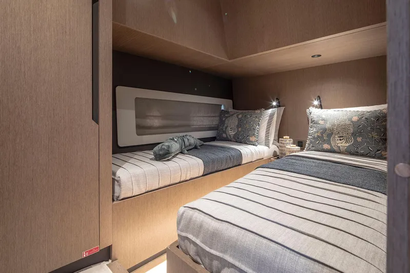  Yacht Photos Pics Cozy cabin interior of 2025 Sirena 48 yacht with twin beds and modern decor.