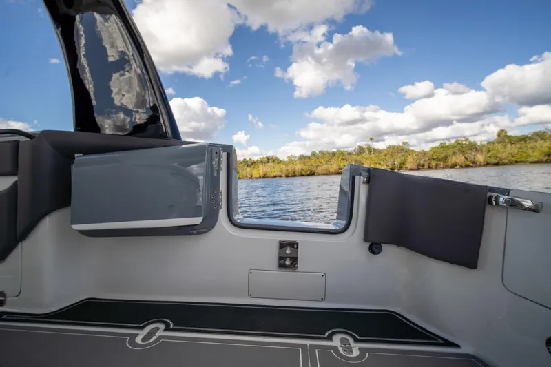  Yacht Photos Pics 2020 MTI V42 boat interior with scenic water view and blue sky.