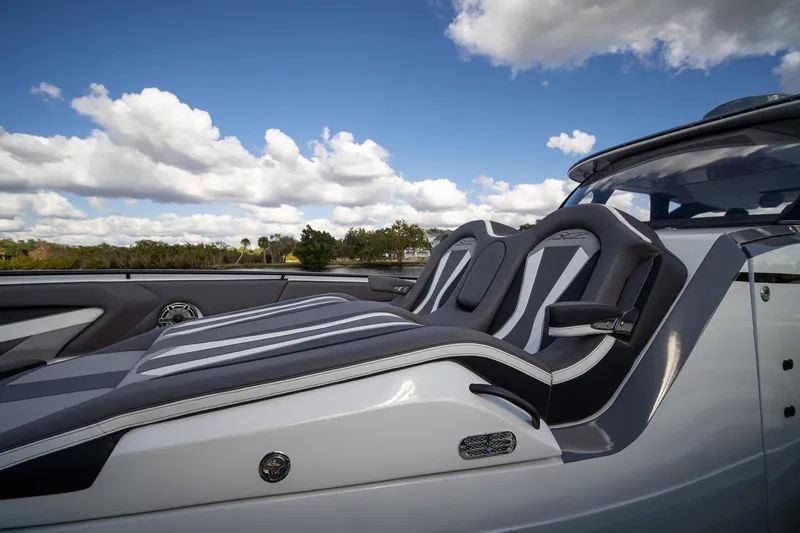  Yacht Photos Pics Luxury seating on MTI V42 boat, 2020 model, under a blue sky with clouds.
