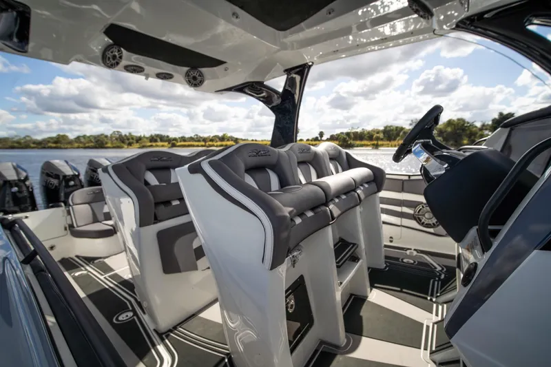  Yacht Photos Pics Luxury interior of 2020 MTI V42 boat with plush seating and modern design.