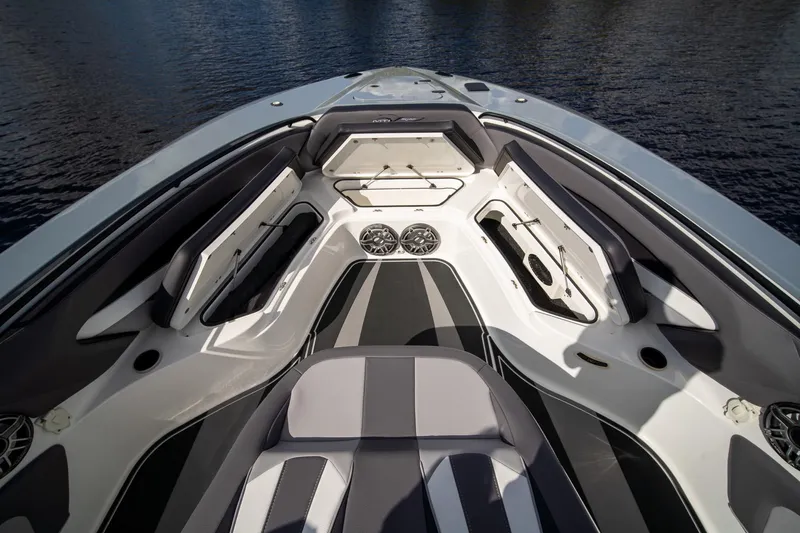 Yacht Photos Pics Luxurious 2020 MTI V42 boat interior with sleek seating and storage compartments.