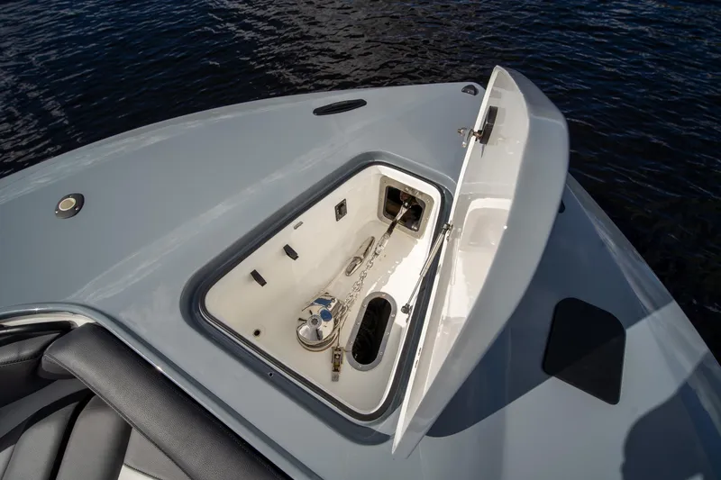  Yacht Photos Pics Open anchor compartment on 2020 MTI V42 boat, with visible chain and winch.