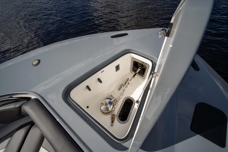  Yacht Photos Pics Open anchor compartment on MTI V42 boat, 2020 model, with visible chain and water background.