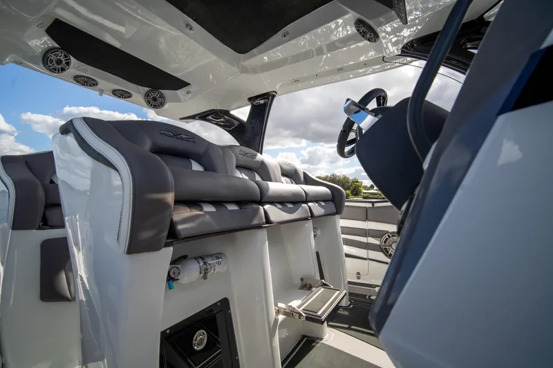  Yacht Photos Pics Interior of 2020 MTI V42 boat with luxurious seating and modern steering wheel.