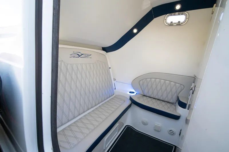  Yacht Photos Pics Interior cabin of 2020 MTI V42 boat with cushioned seating and modern design.