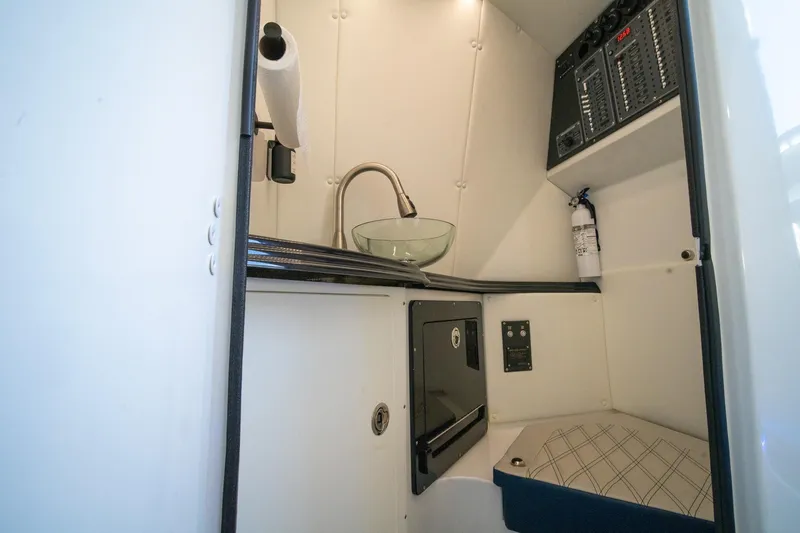  Yacht Photos Pics 2020 MTI V42 boat interior with sink, control panel, and fire extinguisher.
