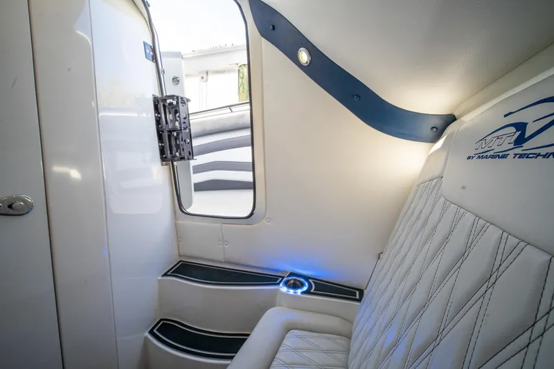  Yacht Photos Pics Interior of 2020 MTI V42 boat with modern seating and ambient lighting.