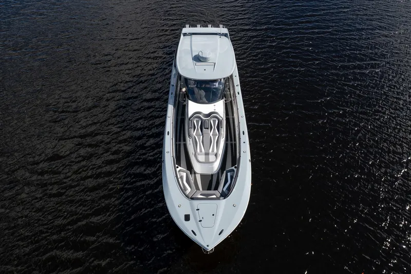  Yacht Photos Pics Aerial view of 2020 MTI V42 luxury yacht on dark water.