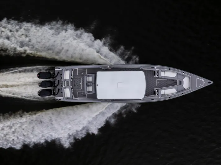  Yacht Photos Pics Overhead view of 2025 Donzi 39 VRZ speedboat on water, creating dynamic wake patterns.