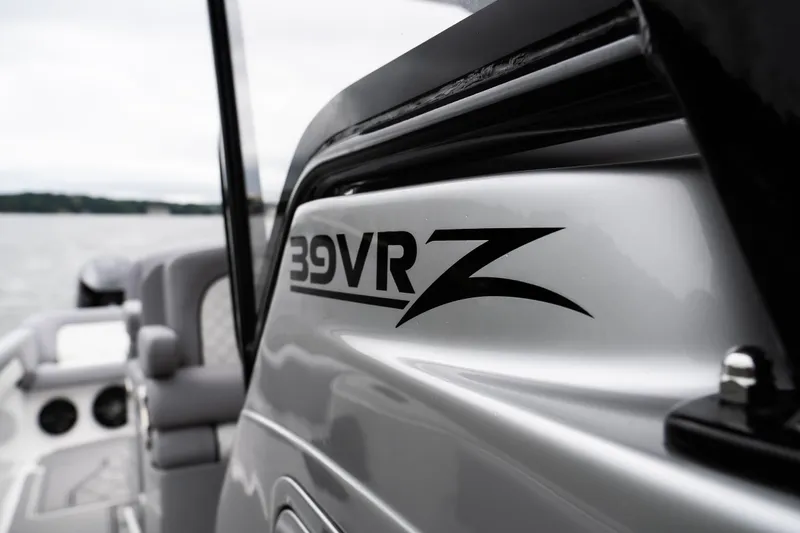  Yacht Photos Pics 2025 Donzi 39 VRZ boat detail on water, showcasing sleek design.