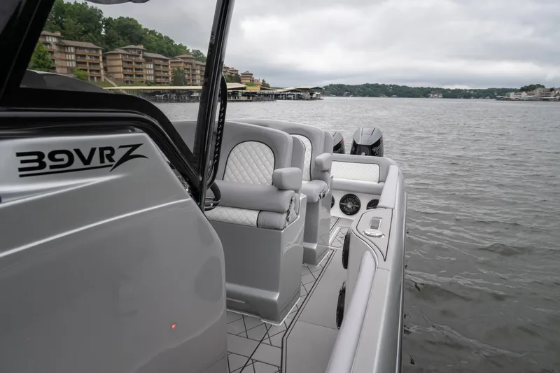  Yacht Photos Pics 2025 Donzi 39 VRZ boat on a lake, featuring sleek design and luxurious seating.