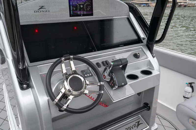  Yacht Photos Pics 2025 Donzi 39 VRZ boat dashboard with modern controls and steering wheel.