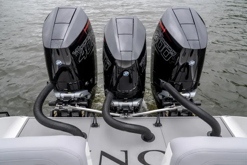  Yacht Photos Pics Triple outboard engines on a 2025 Donzi 39 VRZ boat, viewed from the rear.