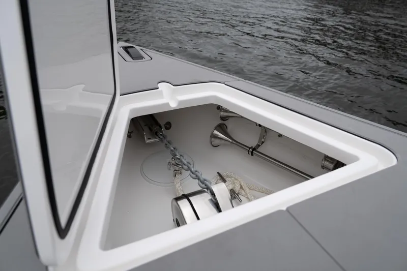  Yacht Photos Pics Anchor compartment of 2025 Donzi 39 VRZ boat, open on calm water.