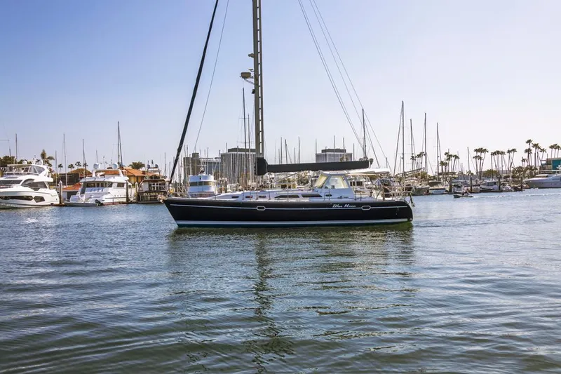 Blue Moon Yacht Photos Pics Catalina 400 MkII sailboat from 2004 docked in a marina with other boats.