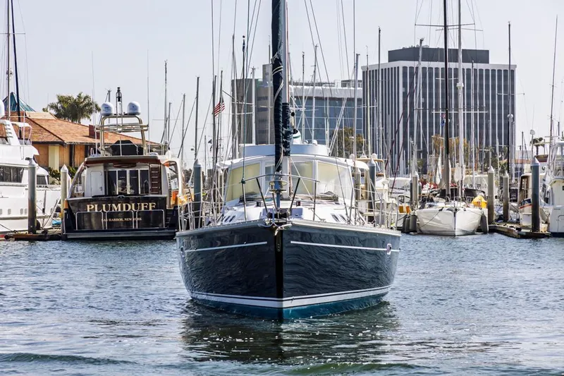Blue Moon Yacht Photos Pics Front view of a 2004 Catalina 400 MkII sailboat docked in a marina.